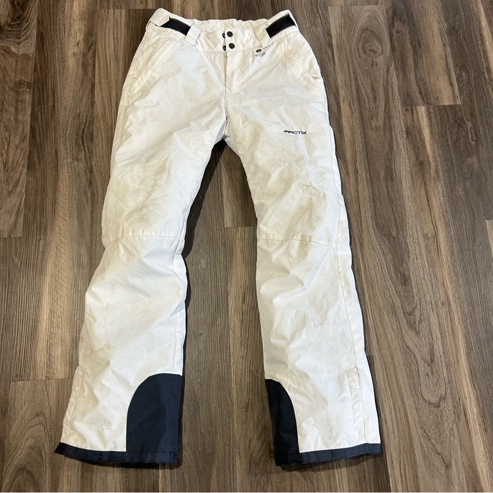 White and grey Arctix snowpants
